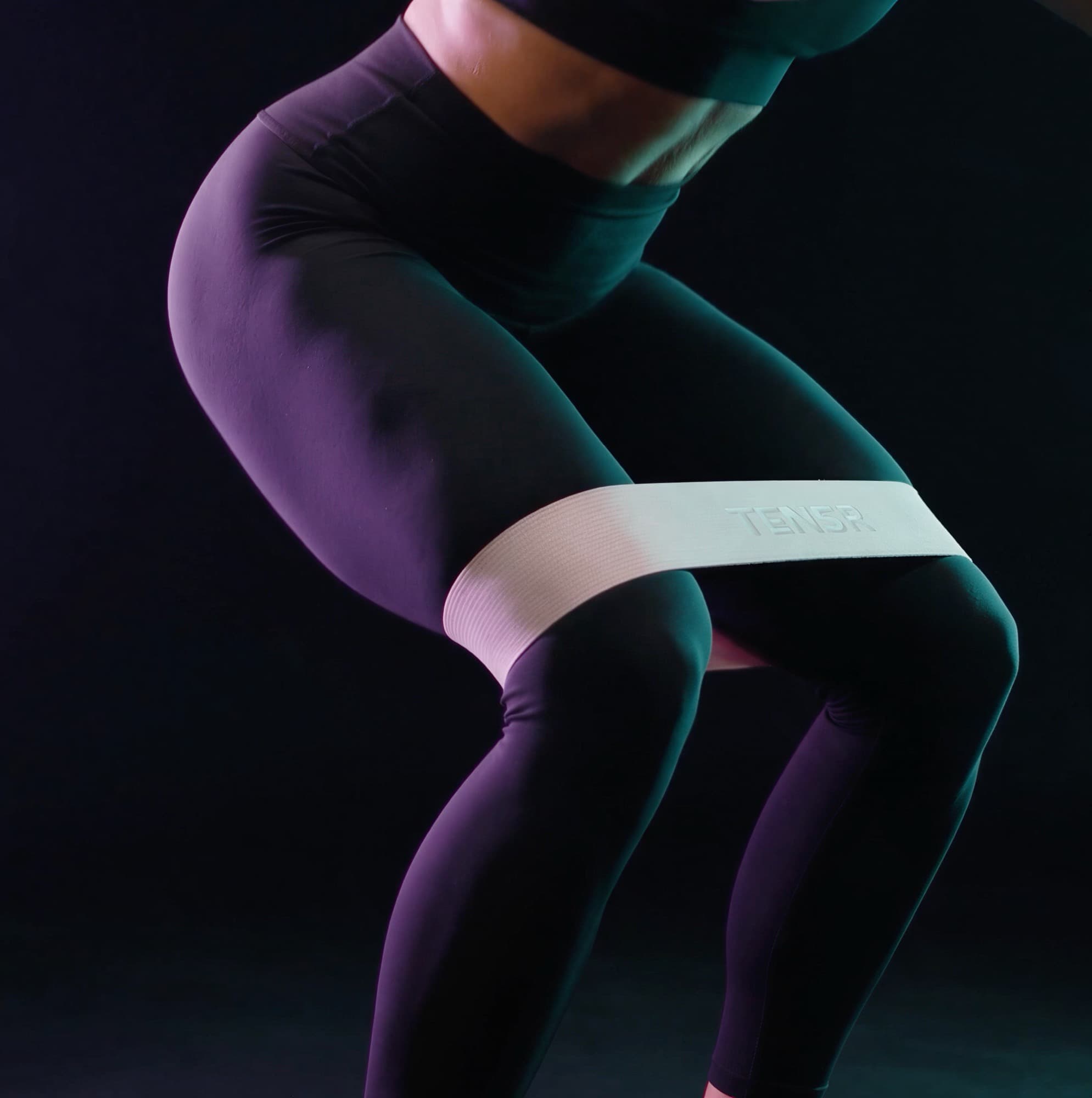TENSR band under tension above the knees